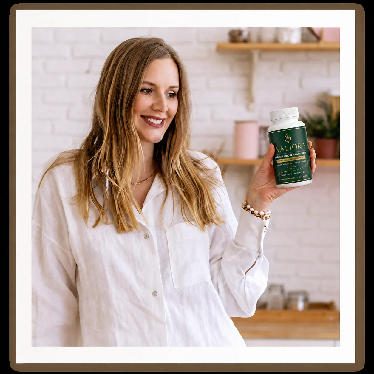 Valiora customer holding the supplement bottle indoors